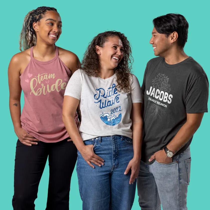 Three people wearing custom printed t-shirts with unique designs for events and occasions.