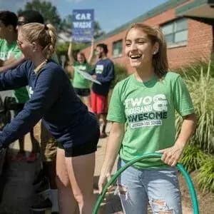Group of students wearing "class of" custom t-shirts and sweatshirts.