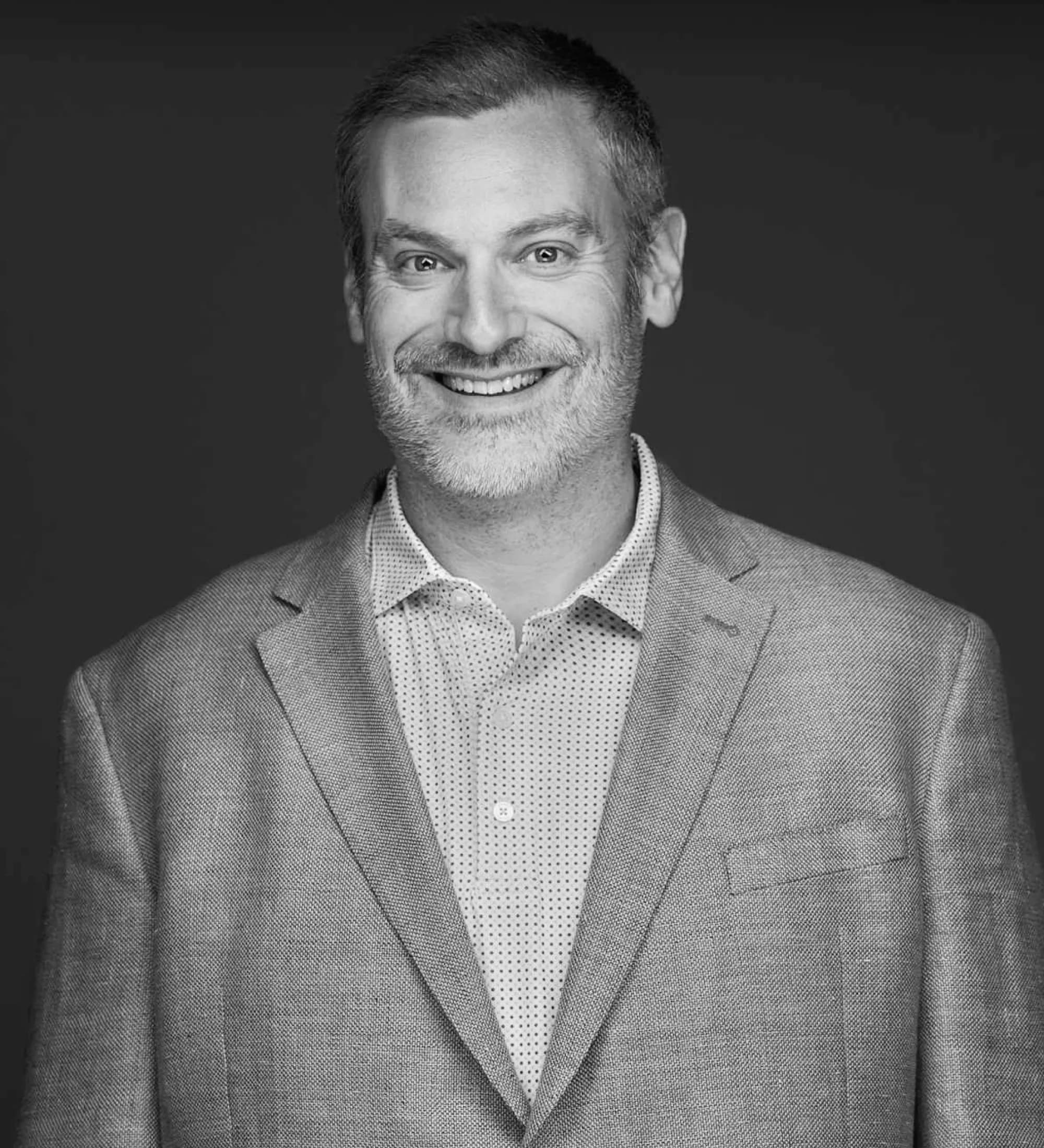 Portrait of Kane Posner in black and white.