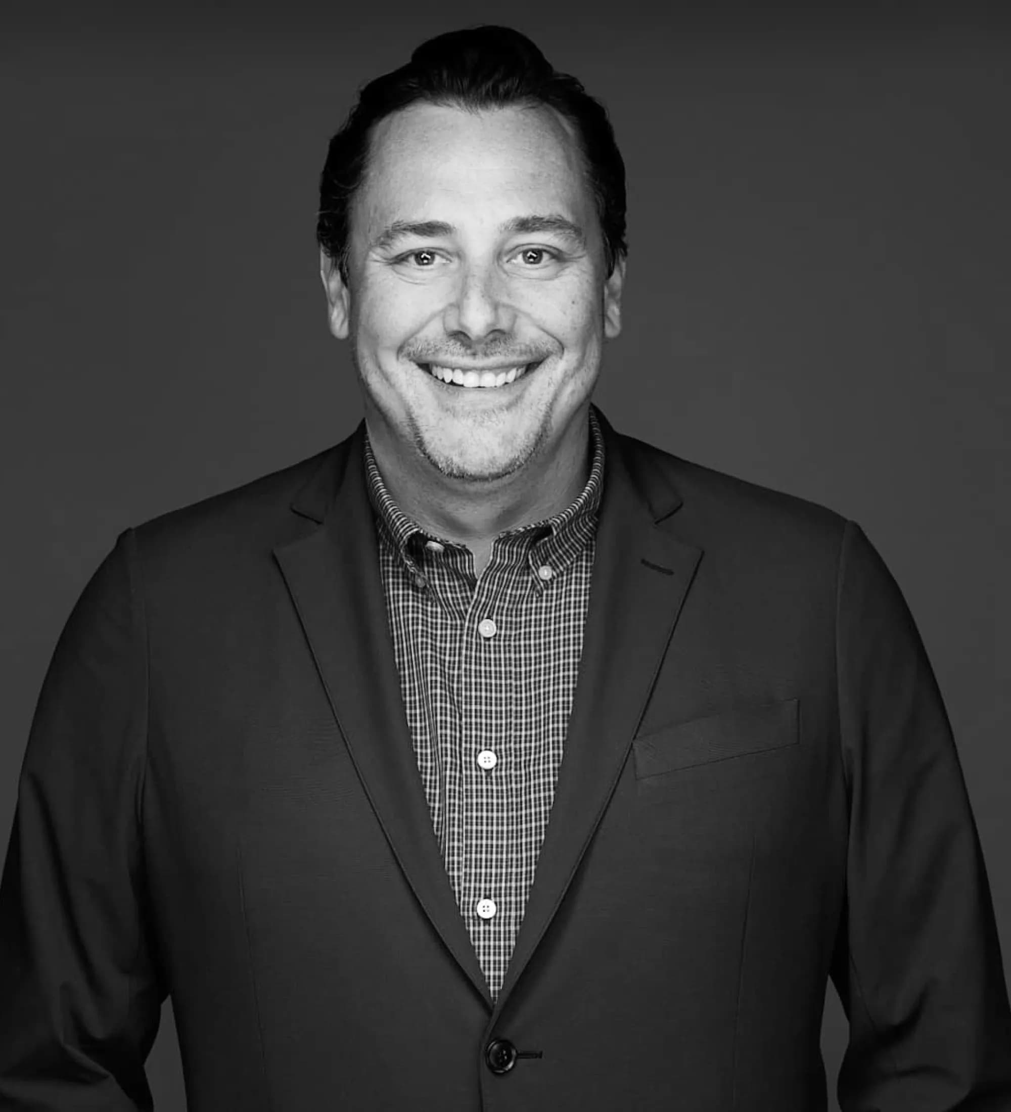Portrait of Ryan Massimo in black and white.