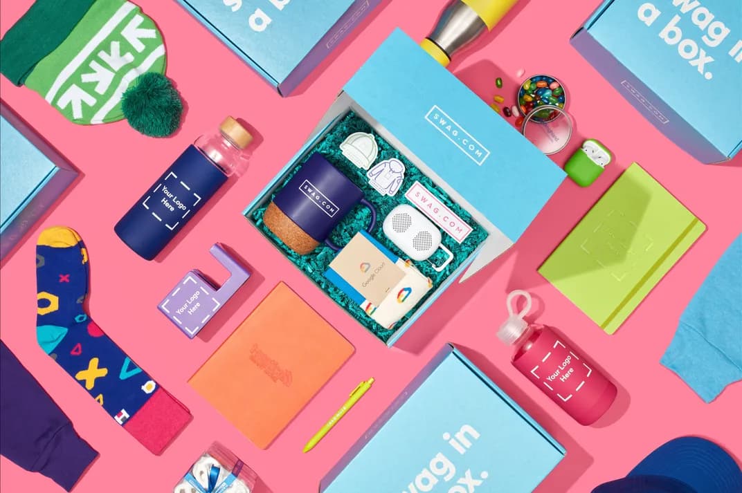 Image depicting Swag In A Box as a service with multiple branded promotional products in boxes. 