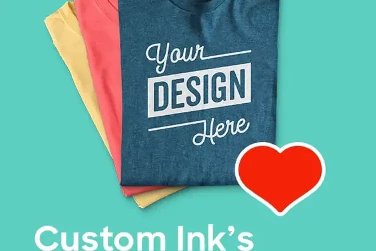 A laydown of folded custom t-shirts with a heart emoji and the text "Custom Ink's 5 Favorite T-shirts".