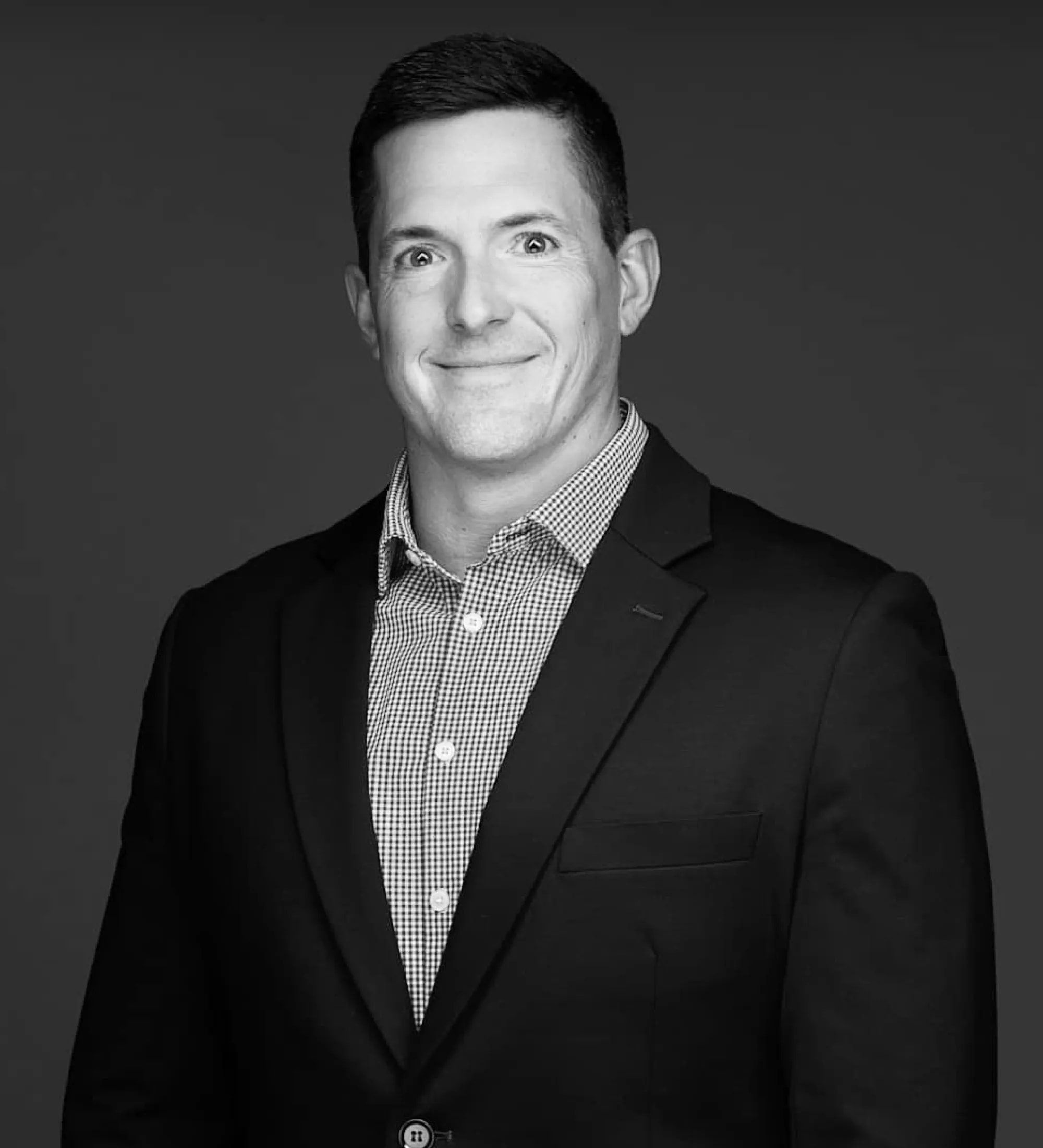 Portrait of Justin Swietlik in black and white.