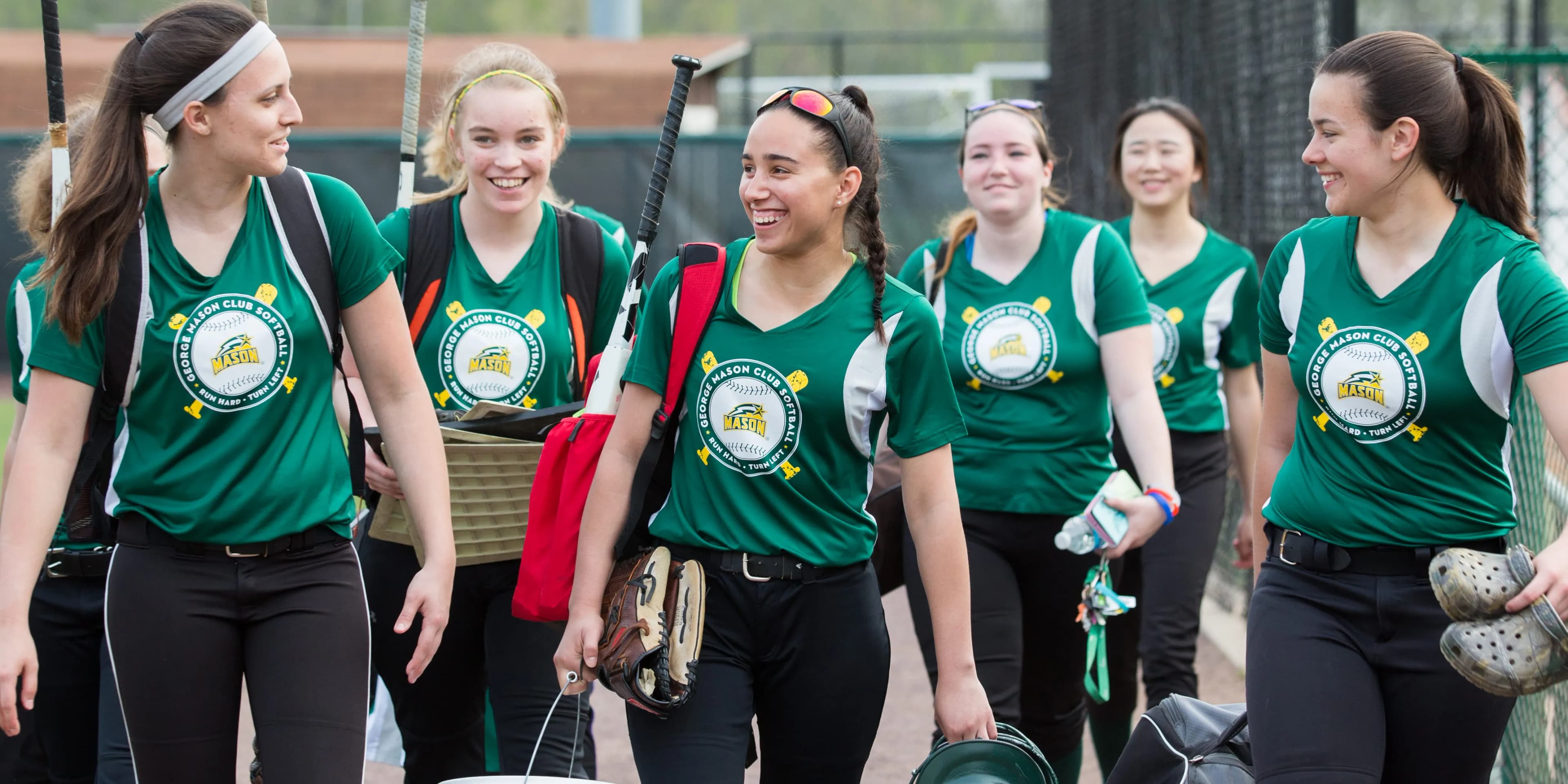 college softball group in custom shirts