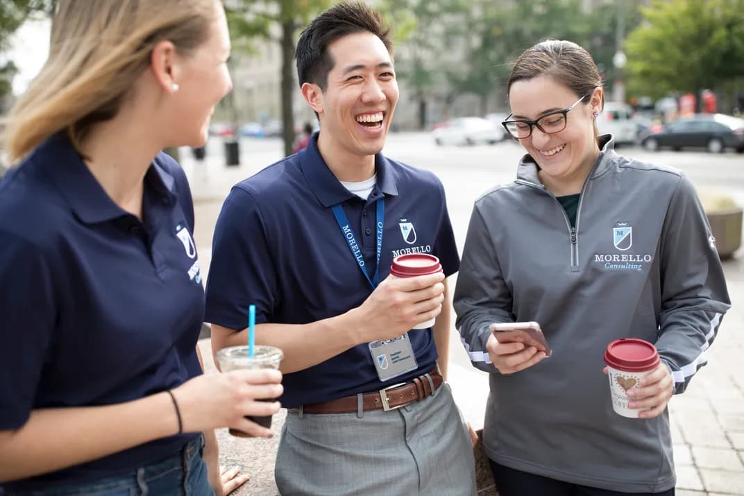 consultants wearing professional-looking uniforms and quarter zips