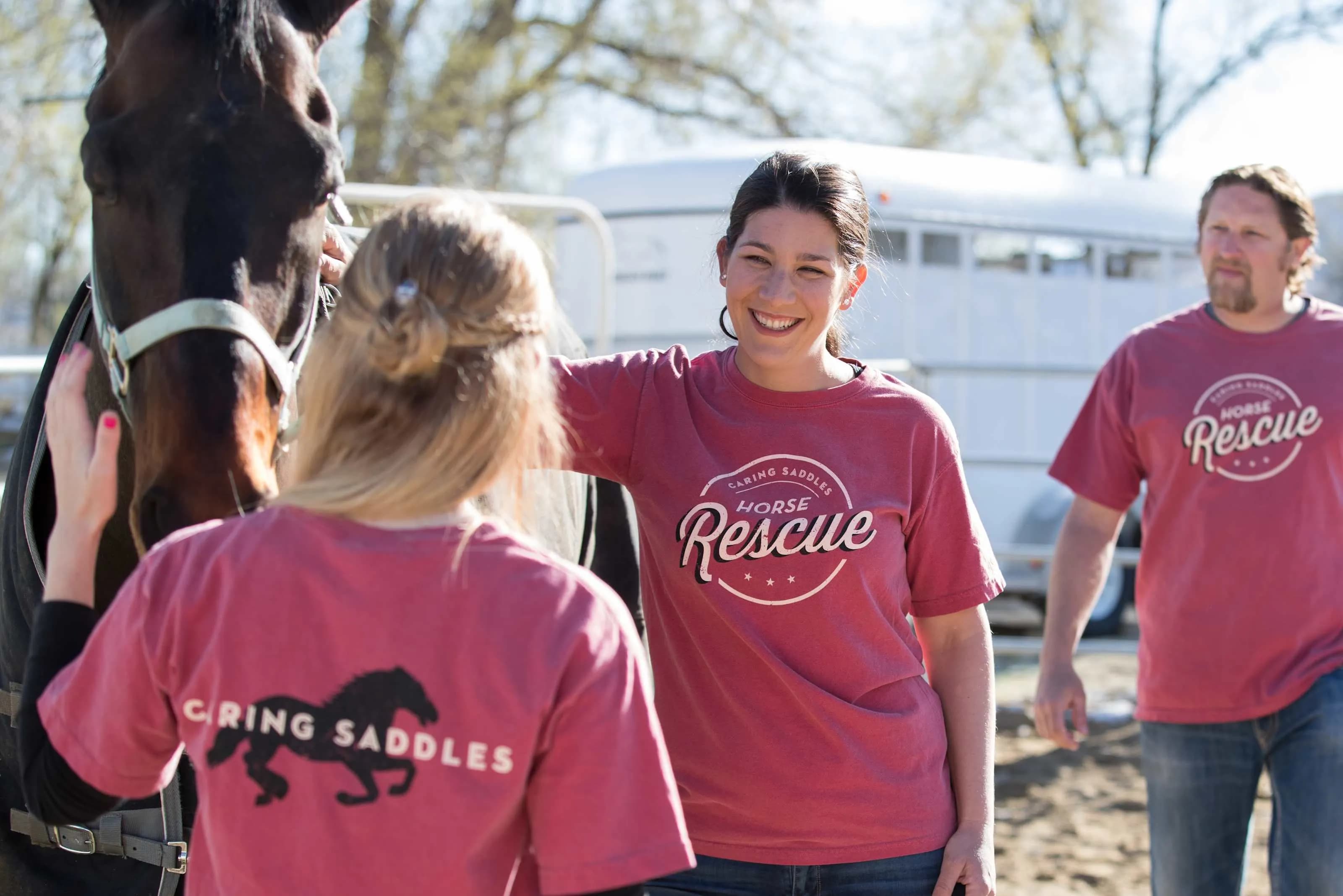 Caring Saddles Horse Rescue volunteers wearing custom t-shirts.