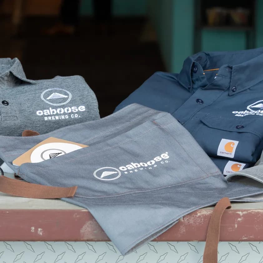 brewery uniforms on a table