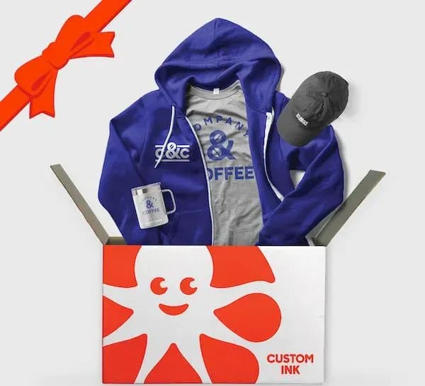 A custom ink box with custom swag for Company & Coffee, including a shirt, zip up hoodie, hat, and travel mug.