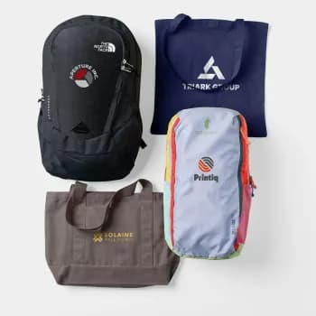 Two backpacks and two tote bags are decorated with company logos