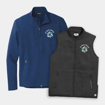 A zip-up jacket and vest lay side by side