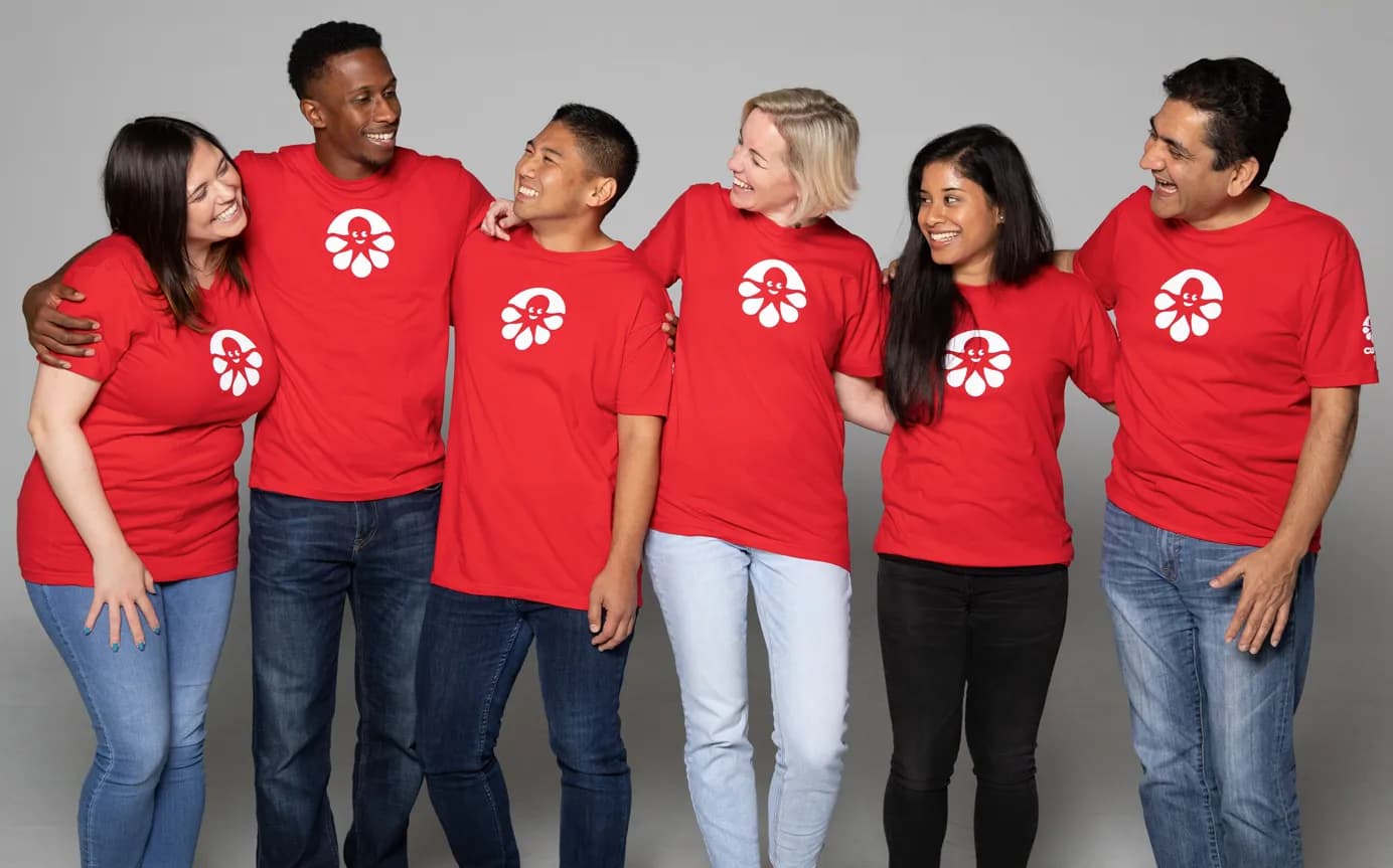 custom ink employees in a group hug