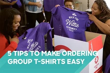 Group unpacking custom purple Alzheimer’s walk t-shirts from a Custom Ink box.