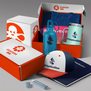 Custom Ink shipping boxes are shown with Printfection gear and logo