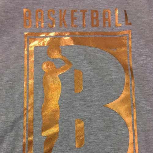 Foil Transfer - Example of gold ink on gray shirt close up