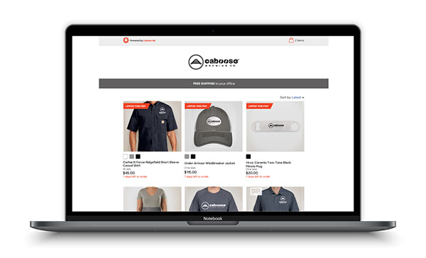 The Custom Ink Online Stores platform diplayed on a laptop and phone