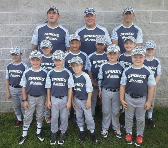 Young tee-ball players in custom team uniforms at their first game