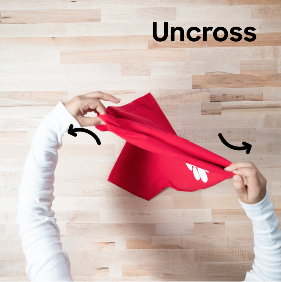 Uncross your hands and pull the shirt.