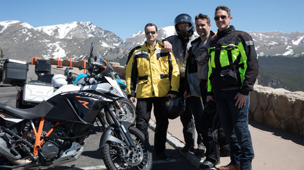 group poses by motorcycles