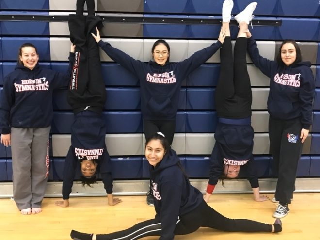 Gymnastics team custom apparel celebrating strength and athletic grace