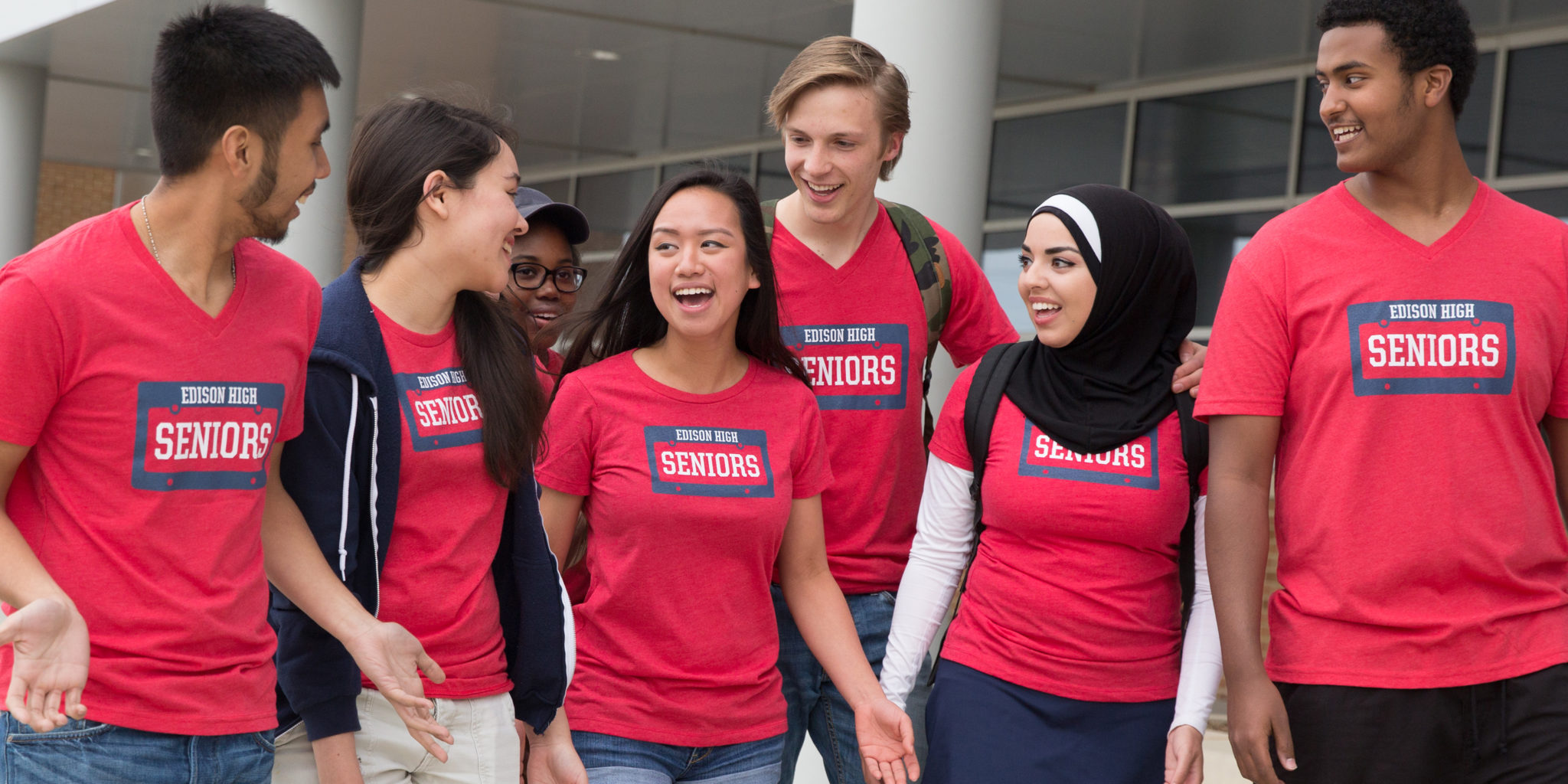 a bunch of kids in matching custom t-shirts that says seniors