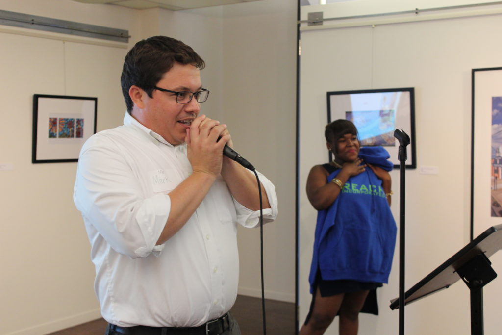 Director and Tutor speaking at an event 