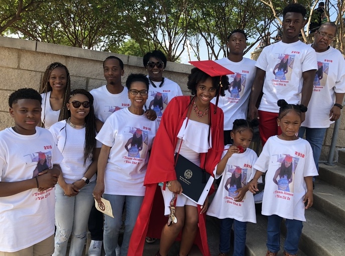 a family poses with graduation senior