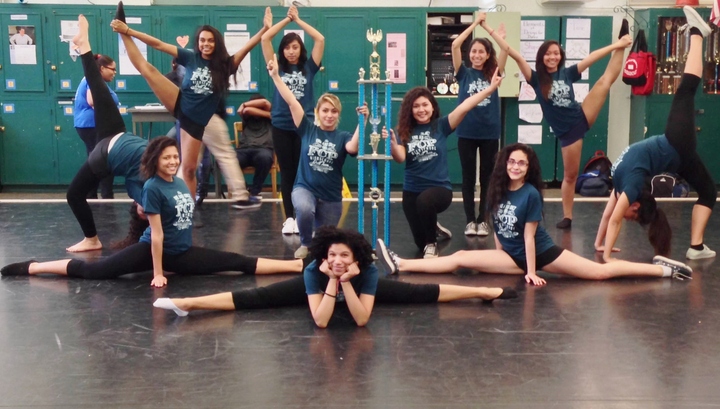 Drill team members in formation wearing custom t-shirts with motivational quotes