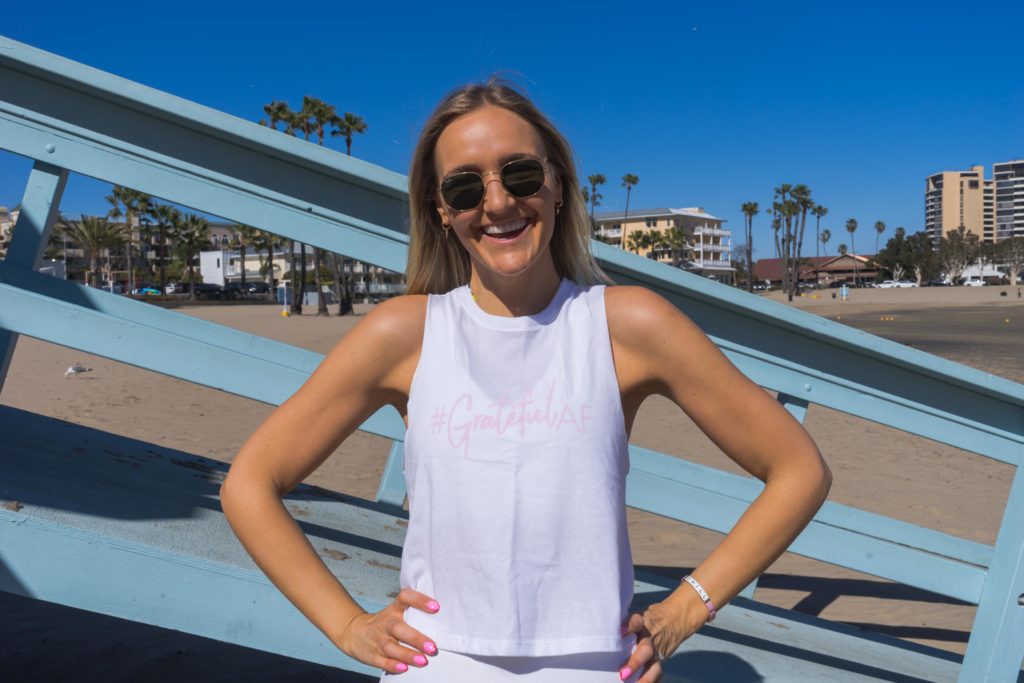 Woman at beach in cropped tank top