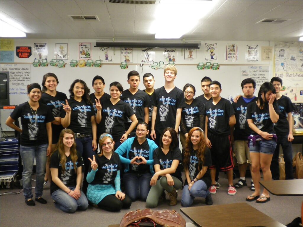A Spanish class wearing their matching custom t-shirts.