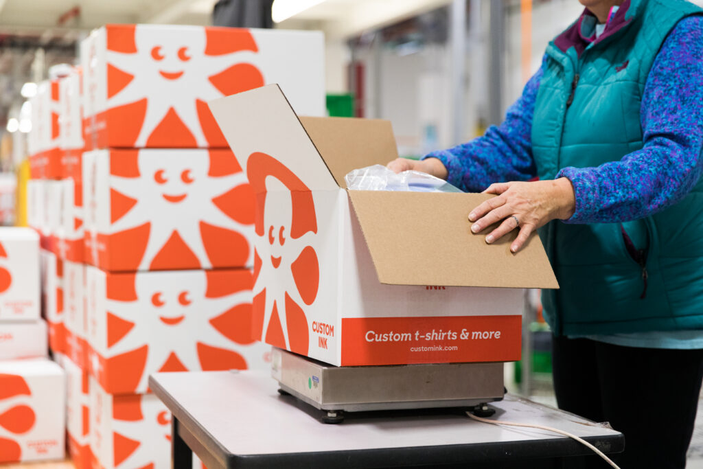 custom t shirts order being packed into a box