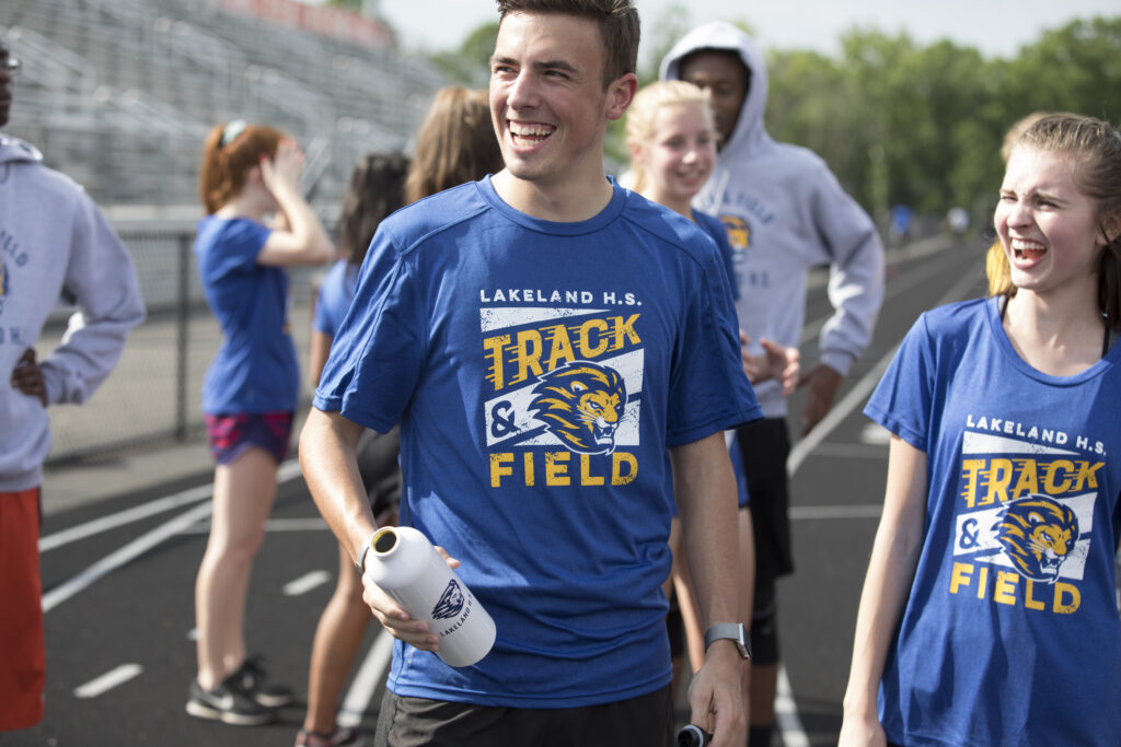 athlete holding a customized water bottle