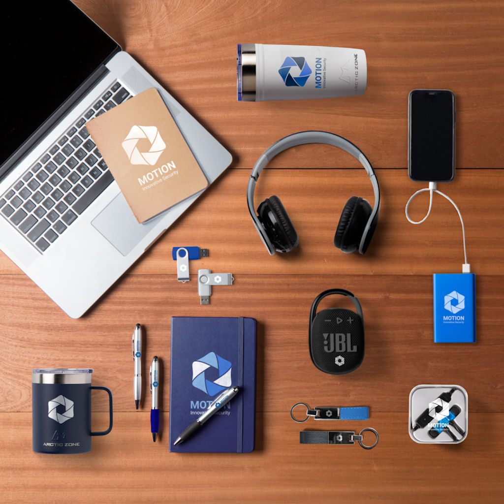 employee's desk filled with welcome kit and onboarding swag