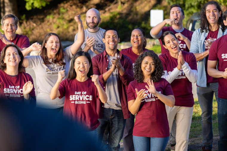 Team members in matching custom shirts at a company event