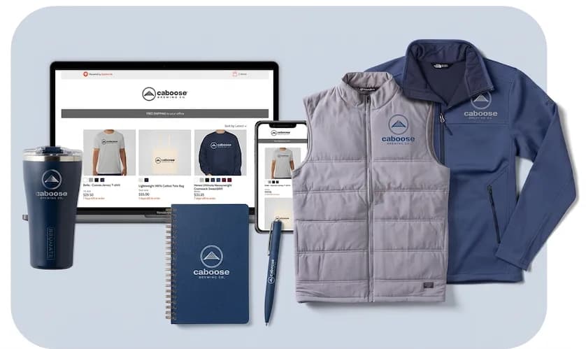 A product mockup image showing a laptop and smartphone displaying an online store next to custom branded apparel and a travel tumbler for Caboose Brewing Co.