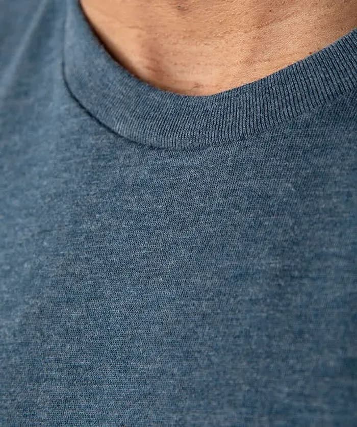 A detail shot of Soft Tri-Blend T-shirt fabrication that highlights the soft texture and heathered weave.