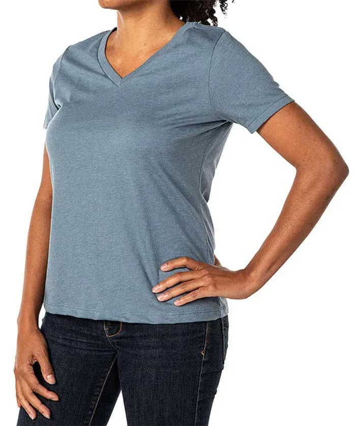 A closeup of a women model wearing a blue v-neck t-shirt.
