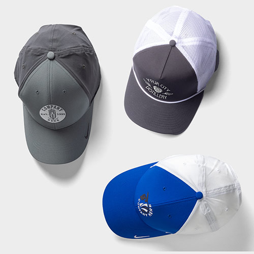 Three customized trucker hats.