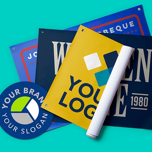 Custom signs and banners are rolled up and displayed together.