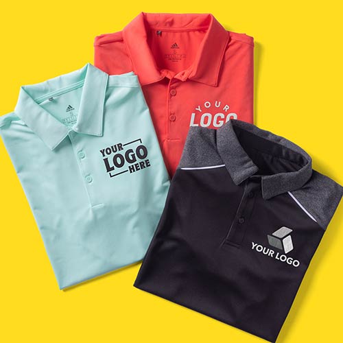 Three customized polos are folded up together.